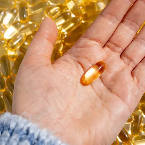 Vitamin D supplement beside a meal in a bright New Zealand kitchen