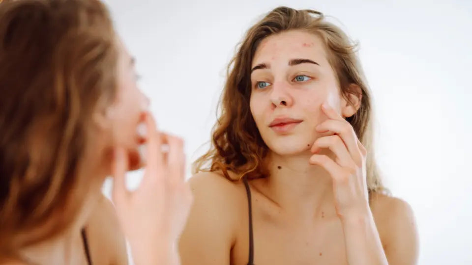 Emu oil beside facial moisturiser in a simple skincare routine