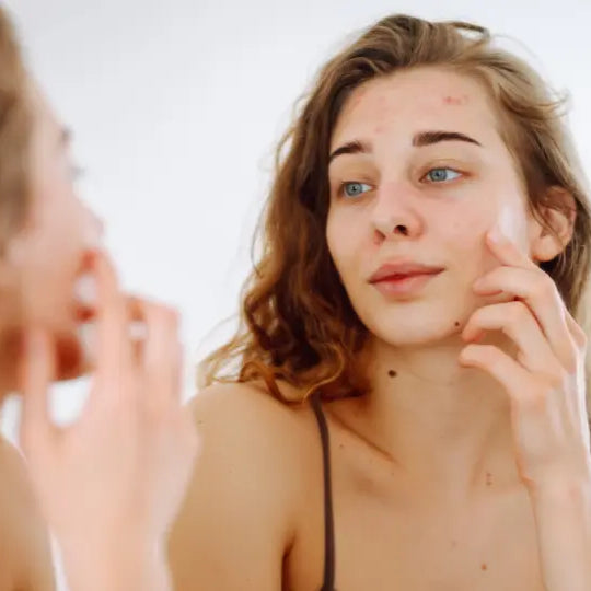 Emu oil beside facial moisturiser in a simple skincare routine