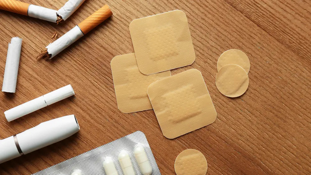 Quit-morning table with nicotine patch, gum, unlit herbal cigarettes and a plan separating withdrawal from smoking routine