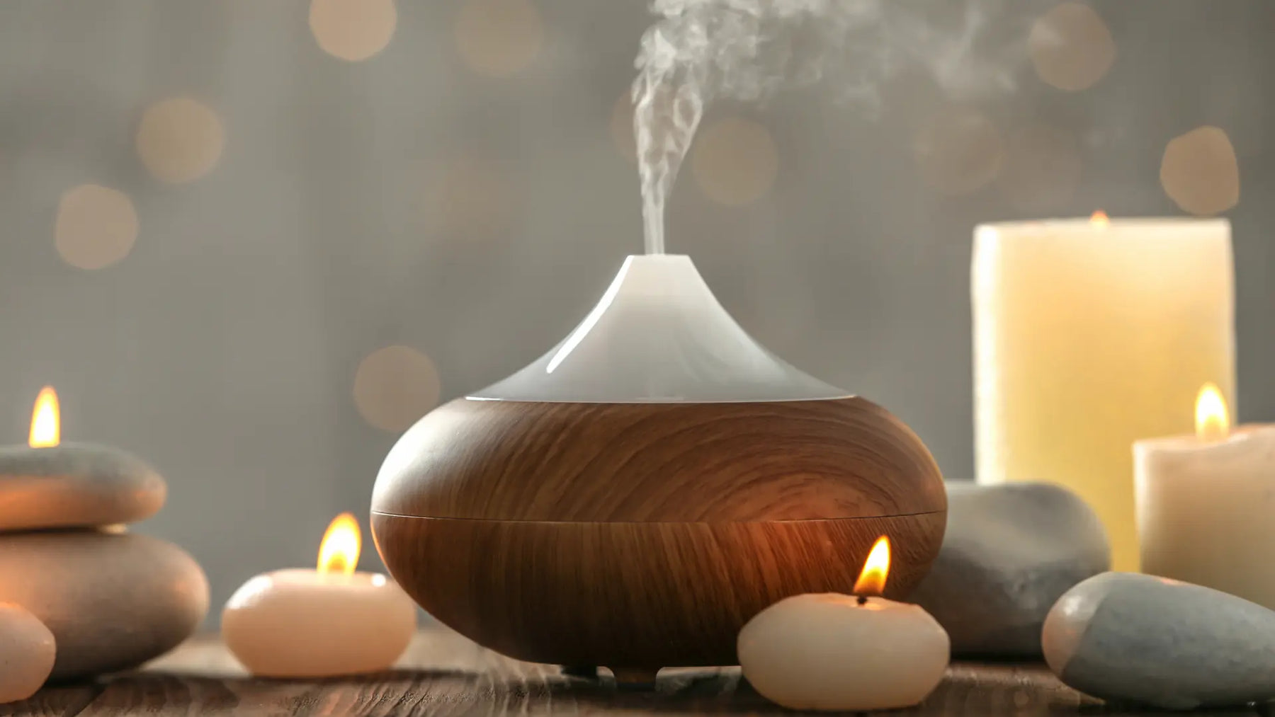 Essential oil diffusers of different tank sizes shown in bedroom, desk and living-room settings with measuring cues