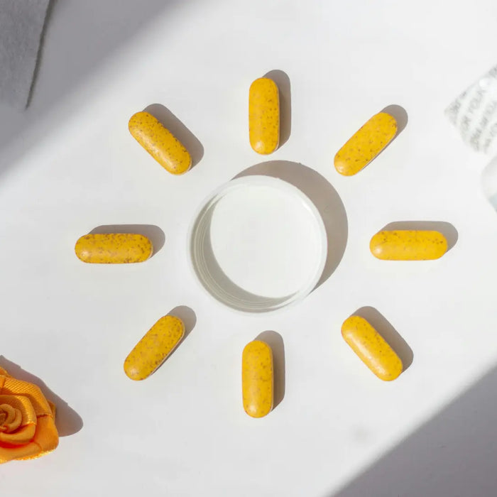 At-home vitamin D screening kit, colour band card, ten-minute timer and result notebook on a clean table
