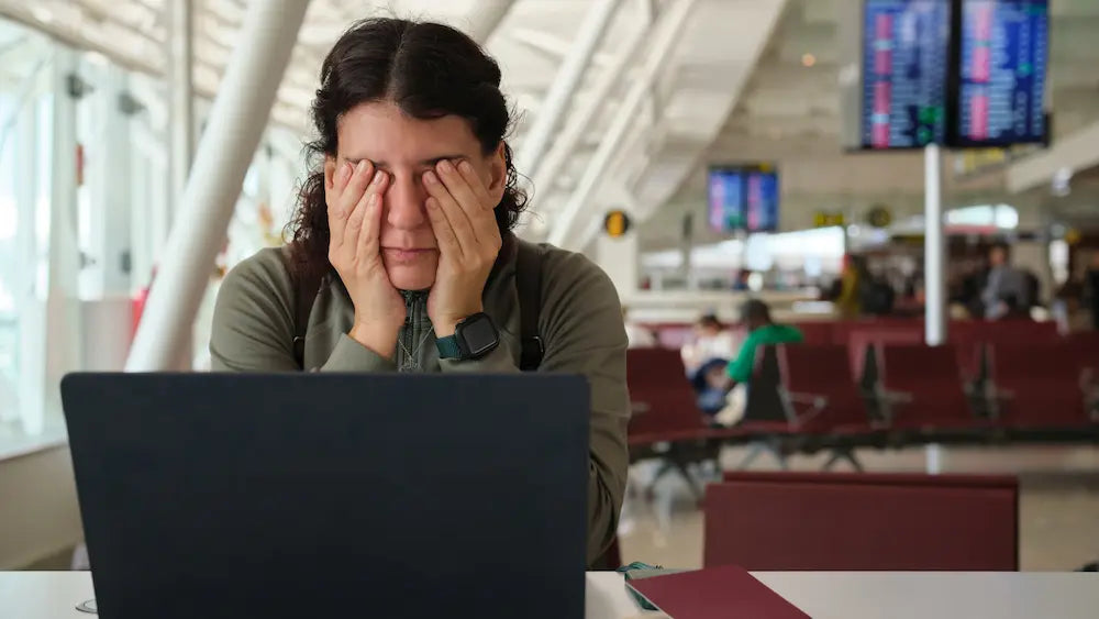 Traveller preparing for a journey with road, air travel and airport cues for a guide to homeopathic travel remedies NZ.