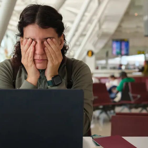 Traveller preparing for a journey with road, air travel and airport cues for a guide to homeopathic travel remedies NZ.