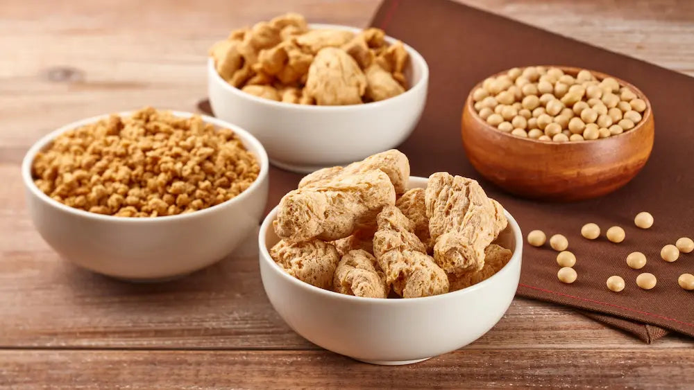 Whey isolate and plant protein tubs beside equal 30 g servings and protein label comparison notes